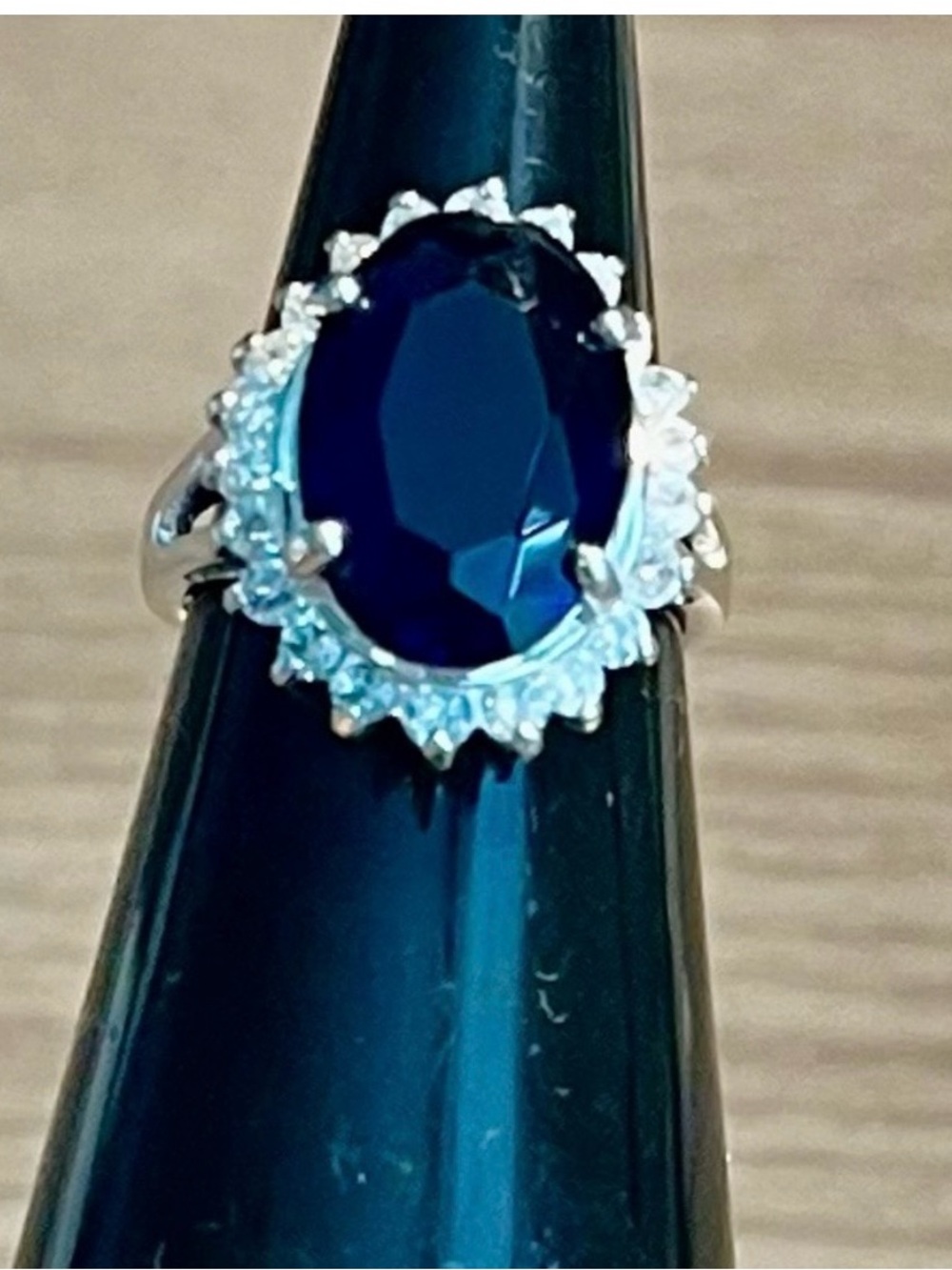 This stunning silver ring features a captivating blue gemstone stamped 925